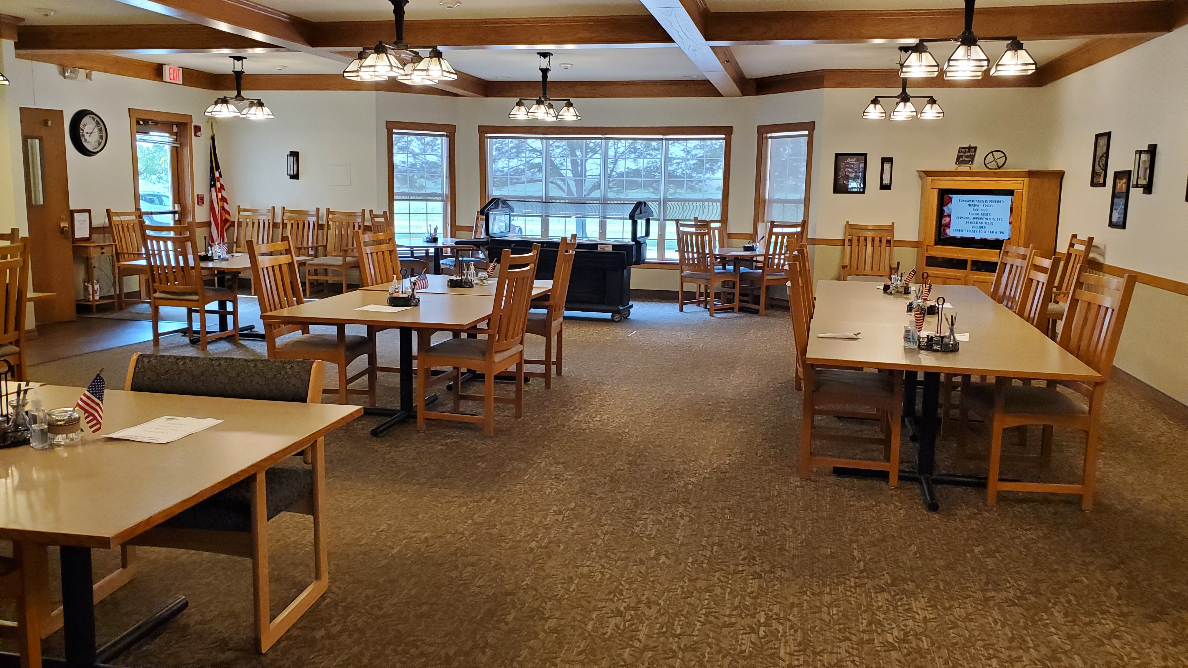 A room with tables and chairs at Windsor Manor Vinton, Vinton, IA